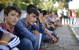 a group of people sitting on a bench