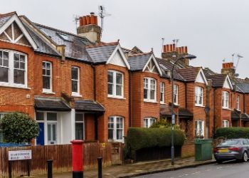 a house that is parked on the side of a building