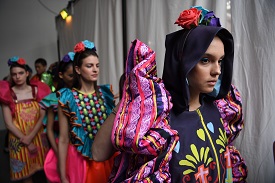 Fashion models backstage, waiting to go out on the catwalk