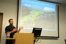 a person standing in front of a computer