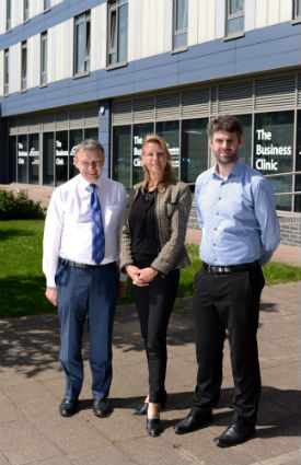 a group of people standing in front of a building