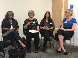 a group of people sitting posing for the camera