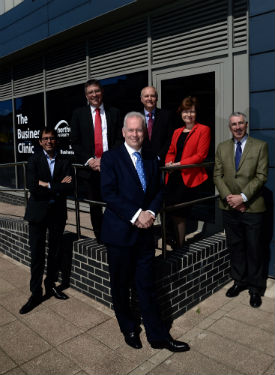 a group of people standing in front of a building