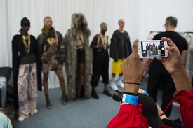 a group of people standing in front of a crowd