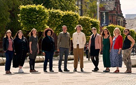 a group of people posing for the camera