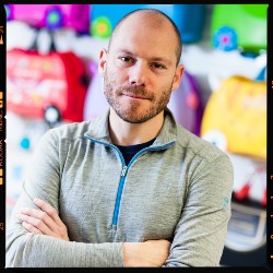 a man sitting in front of a computer screen
