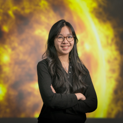 an image of Ramada Sukarmadji of Northumbria University standing in front of a picture of the sun
