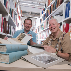 Bob Stanley and Brian Ward pictured looking at books and records and Newcastle City Library