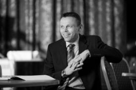 a person sitting in a chair talking on the phone