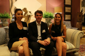 a man and a woman sitting on a couch posing for the camera