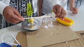 a person sitting at a table eating food