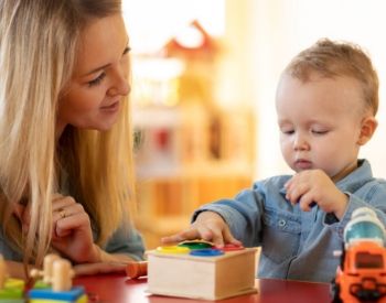 a small child sitting on a table