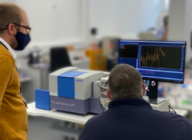 Dr Marc Etherington takes delivery of the Fluorescence Spectrometer from HORIBA UK's Service Engineer, Wayne Twigger.