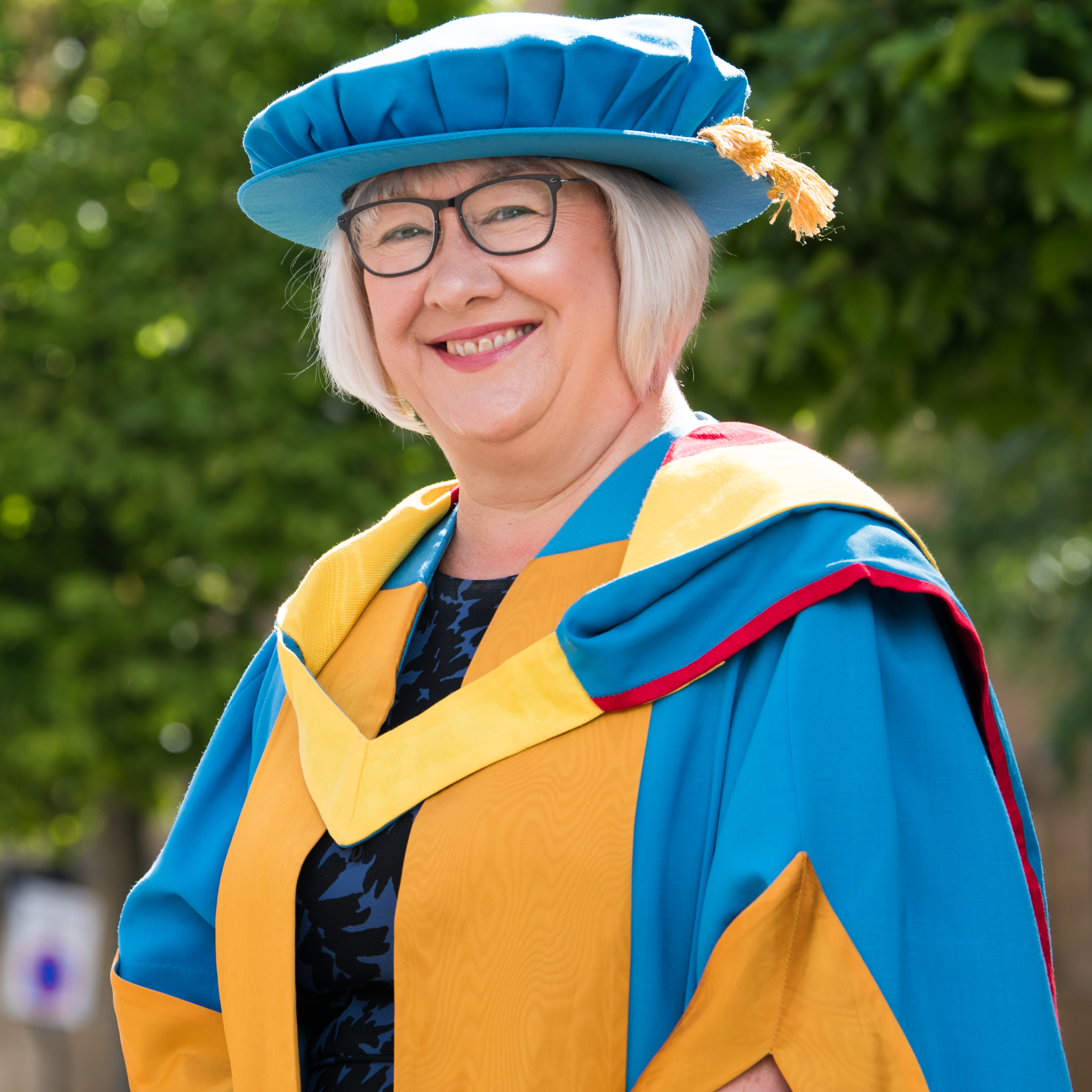 Pat Ritchie in academic dress on the University's City Campus before receiving her Honorary Degree