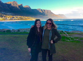 a person standing in front of a body of water