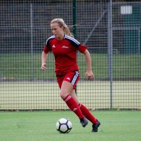 a group of baseball players playing a football game