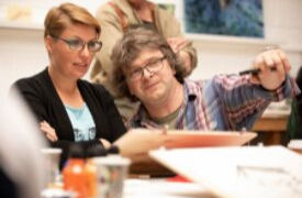a group of people sitting at a table
