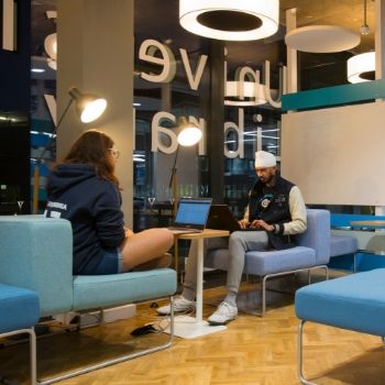 a group of people sitting at a table