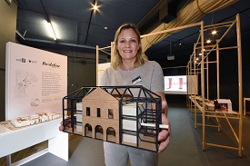 a person standing in front of a table