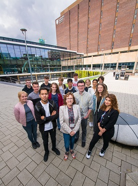 a group of people standing in front of a building