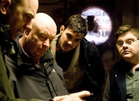 a group of people around each other