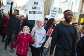 a group of people standing in front of a building