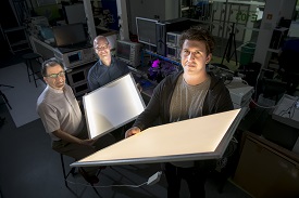 a group of people sitting at a desk