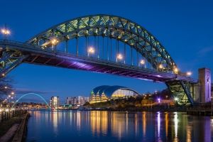 a train crossing a bridge over a river