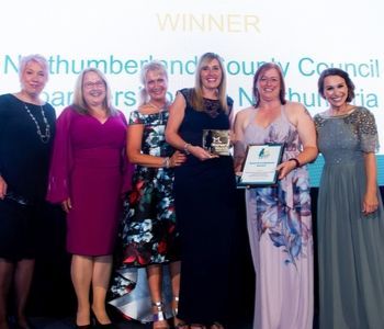 a group of people posing for a photo