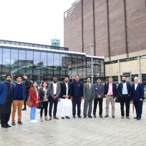 a group of people standing in front of a building