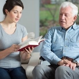 a group of people sitting and looking at the camera