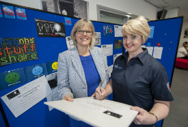 a man and a woman in a blue shirt