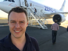 a person standing in front of a plane