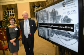 a group of people standing in front of a store