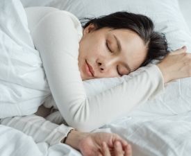 a person lying on a bed