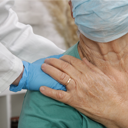 Healthcare worker supporting patient