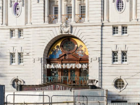 a clock tower in front of a building