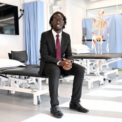 Daniel Indi Te sitting in Northumbria's Physiotherapy Clinic 