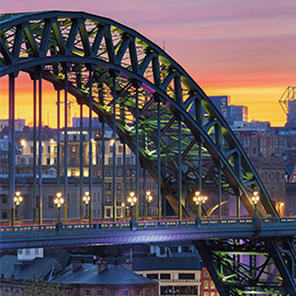 a train crossing a bridge over a river