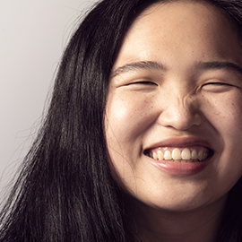 girl sitting on skateboard
