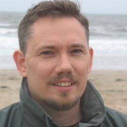 a man smiling for the camera