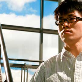 a man standing in front of a window