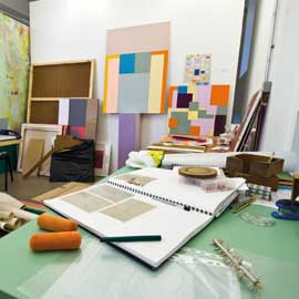 a desk with a computer on a table