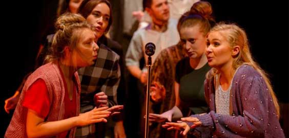 a group of people looking at each other