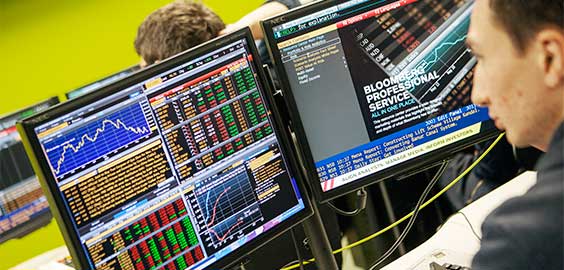 a person standing in front of a computer