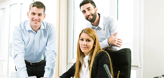 a man and a woman standing next to a window
