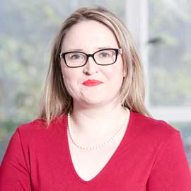 a person in glasses looking at the camera