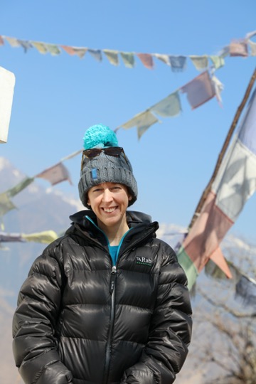 Katie Oven standing on mountain wearing a coat