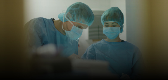 Two nursing staff wearing PPE
