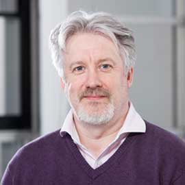 a man standing in front of a building